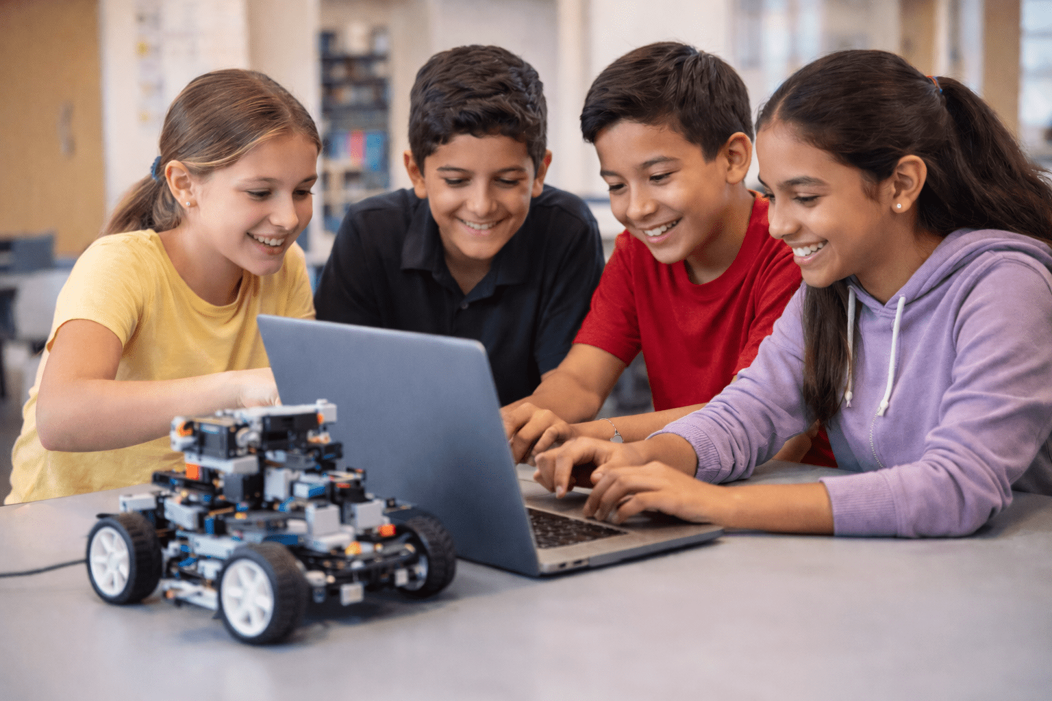Campers collaborating on a robotics activity